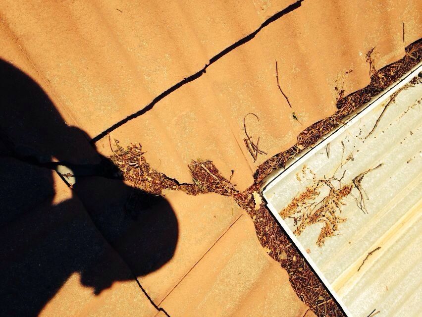 Old waterproofing that has cracked on a tiled roof